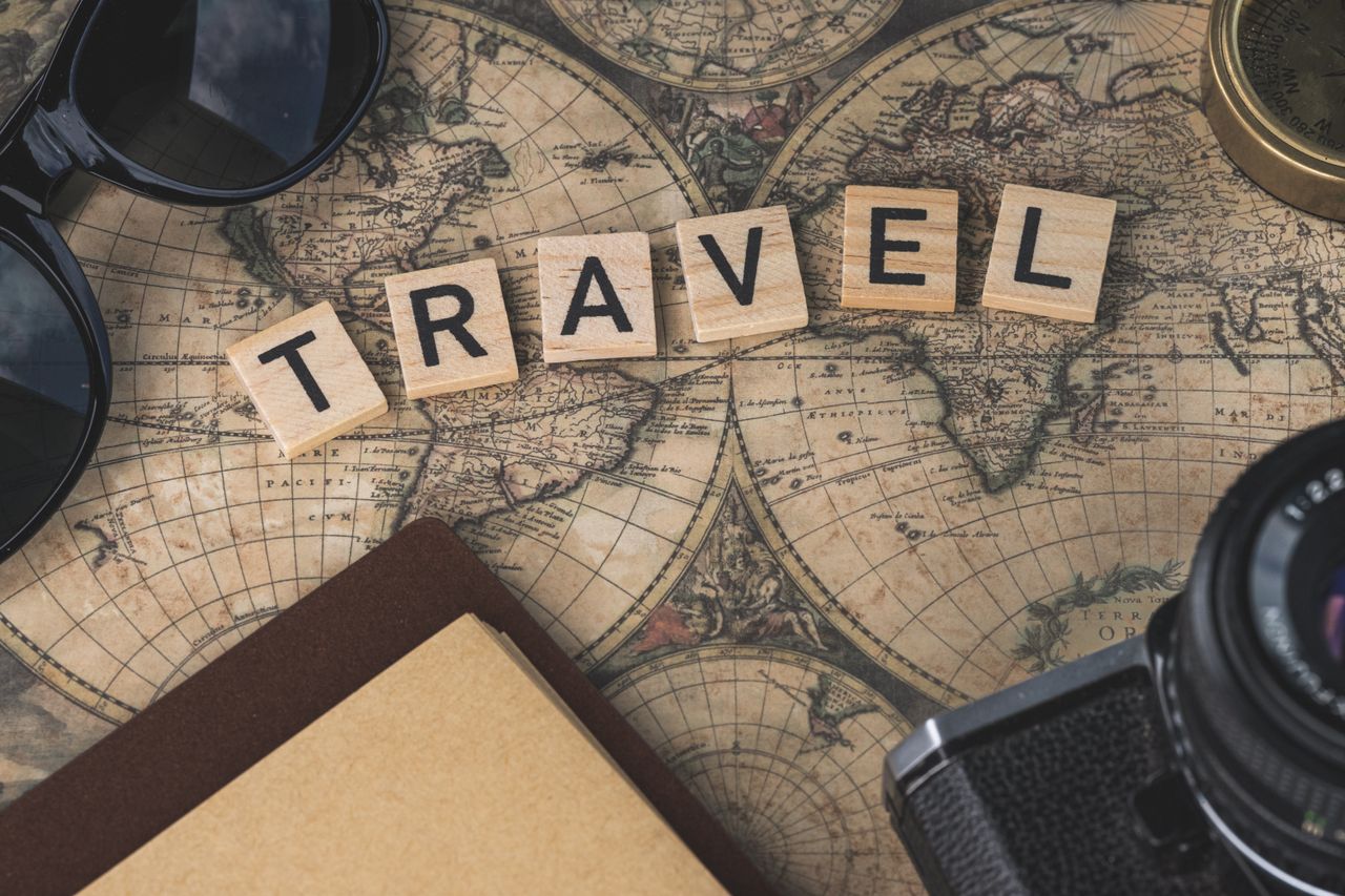 Crafting Captivating Headlines: Your awesome post title goes here Vintage map with travel essentials like camera and sunglasses arranged in a flat lay, perfect for adventure themes.
